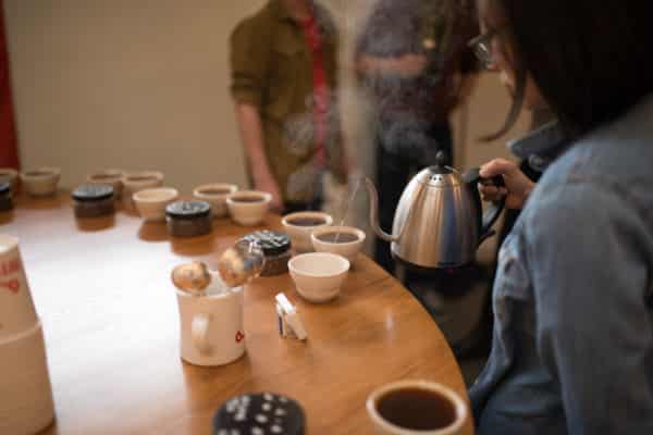 cupping table pouring coffee