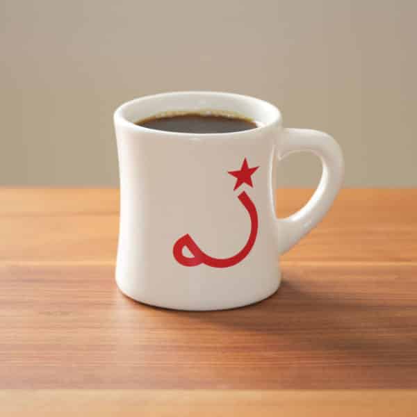 white diner mug on wood table