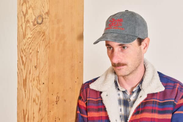 Model wearing 6-panel snake hat
