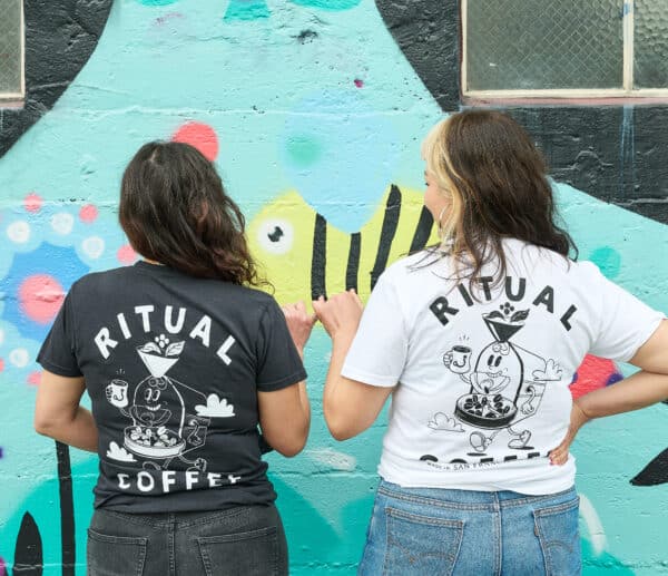 Two models wearing the roaster shirt in black and white