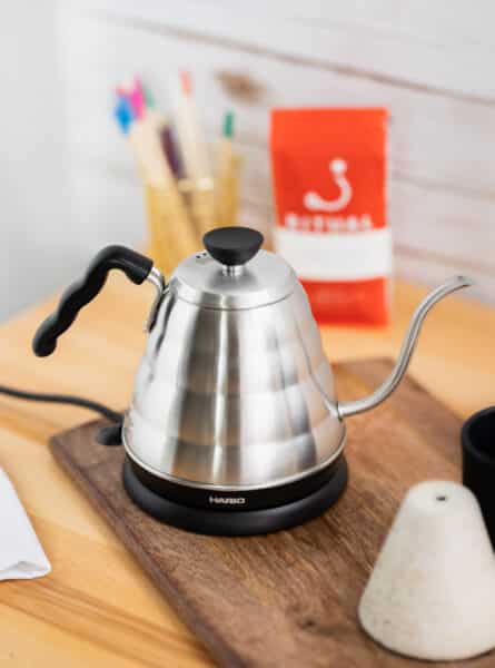 Hario Electric Buono Kettle on a wooden cutting board