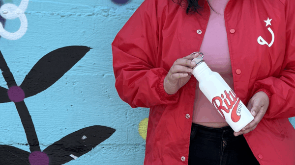 model holding 18oz water bottle