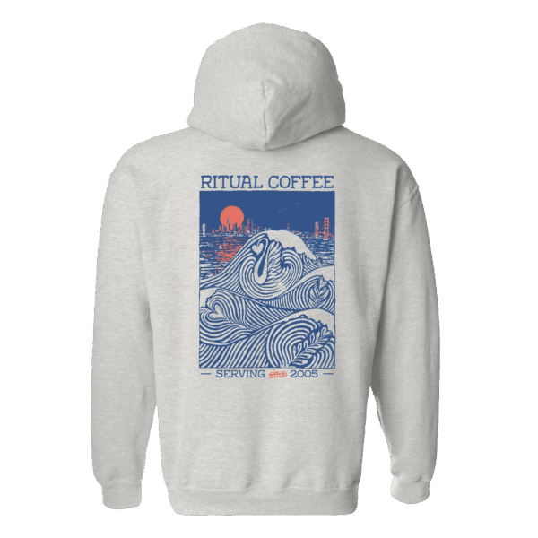 Back of grey hoodie with latte art ocean waves